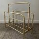 Vintage magazine holder in gold metal