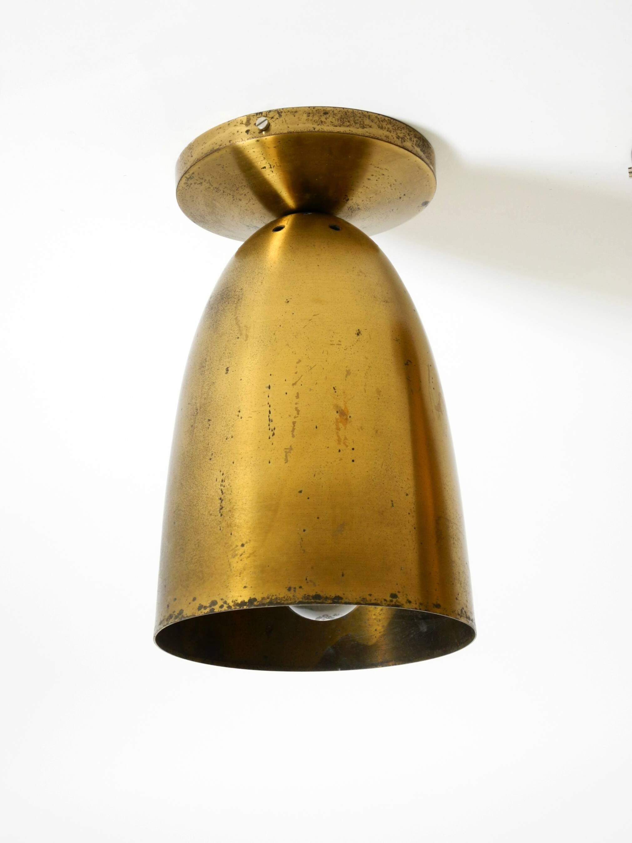 A pair of large, original Mid Century Modern brass ceiling lamps