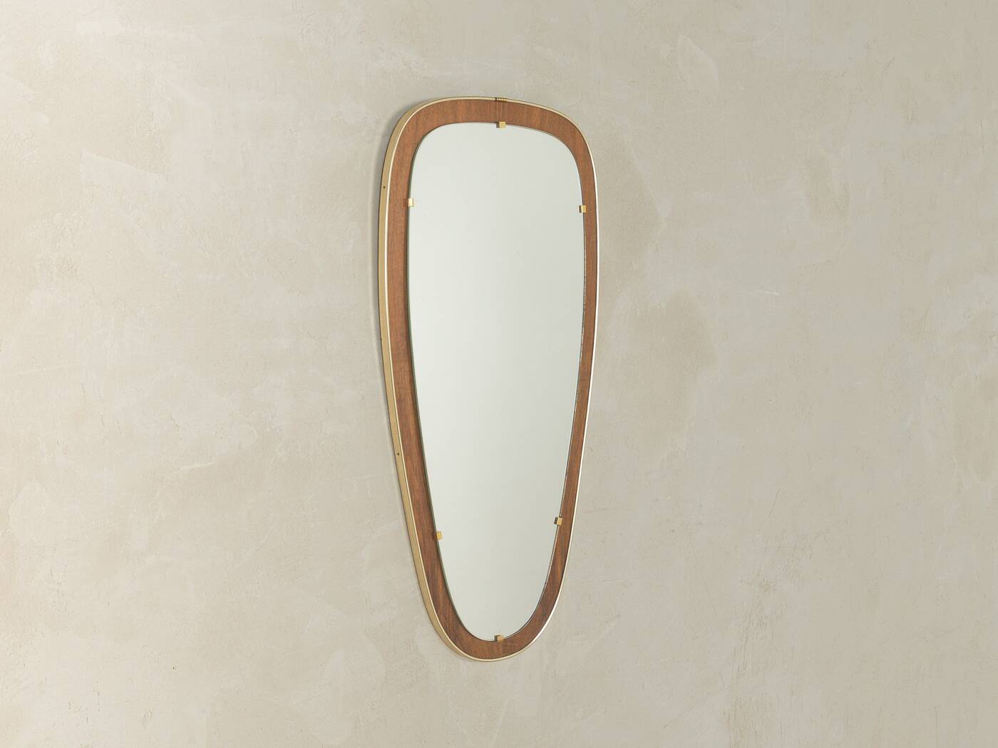 Wonderful 1950s mirror on a teak wood panel with brass frame. Made in Germany