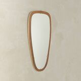 Wonderful 1950s mirror on a teak wood panel with brass frame. Made in Germany