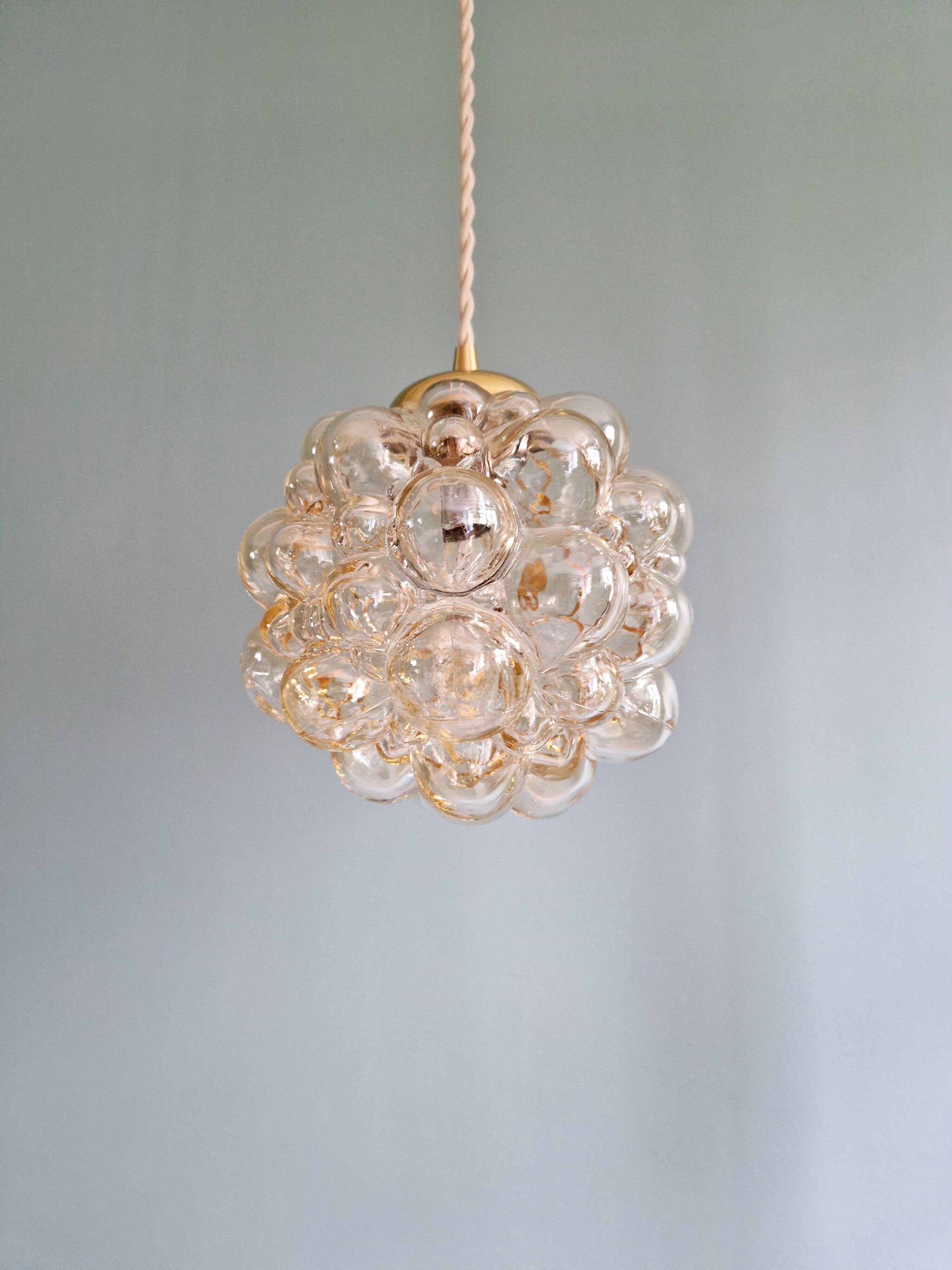 Amber bubble glass pendant (3 available), design by Helena Tynell, 1970.