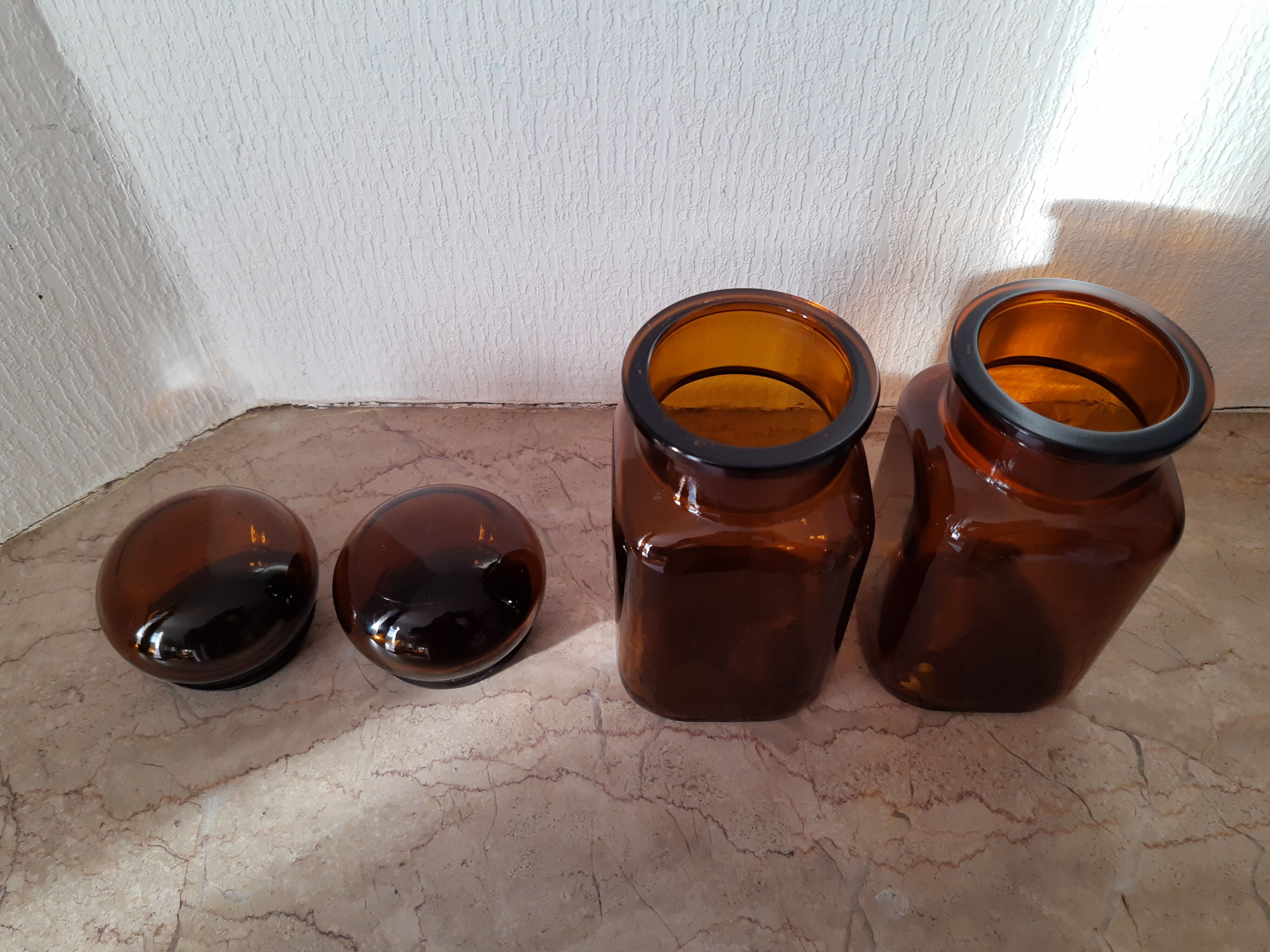 Pair of vintage amber glass jars
