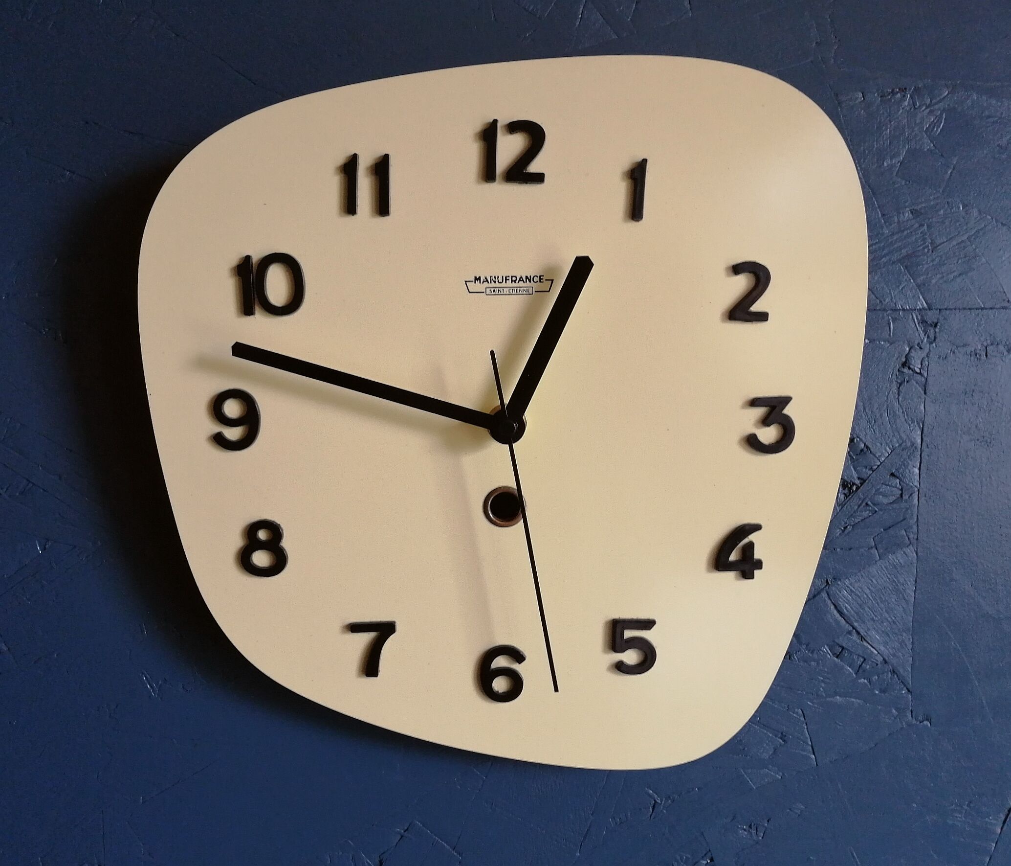 Clock formica vintage asymmetrical silent wall clock "Manufrance pale yellow"