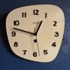 Clock formica vintage asymmetrical silent wall clock "Manufrance pale yellow"