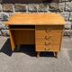 Double-sided desk with compass legs