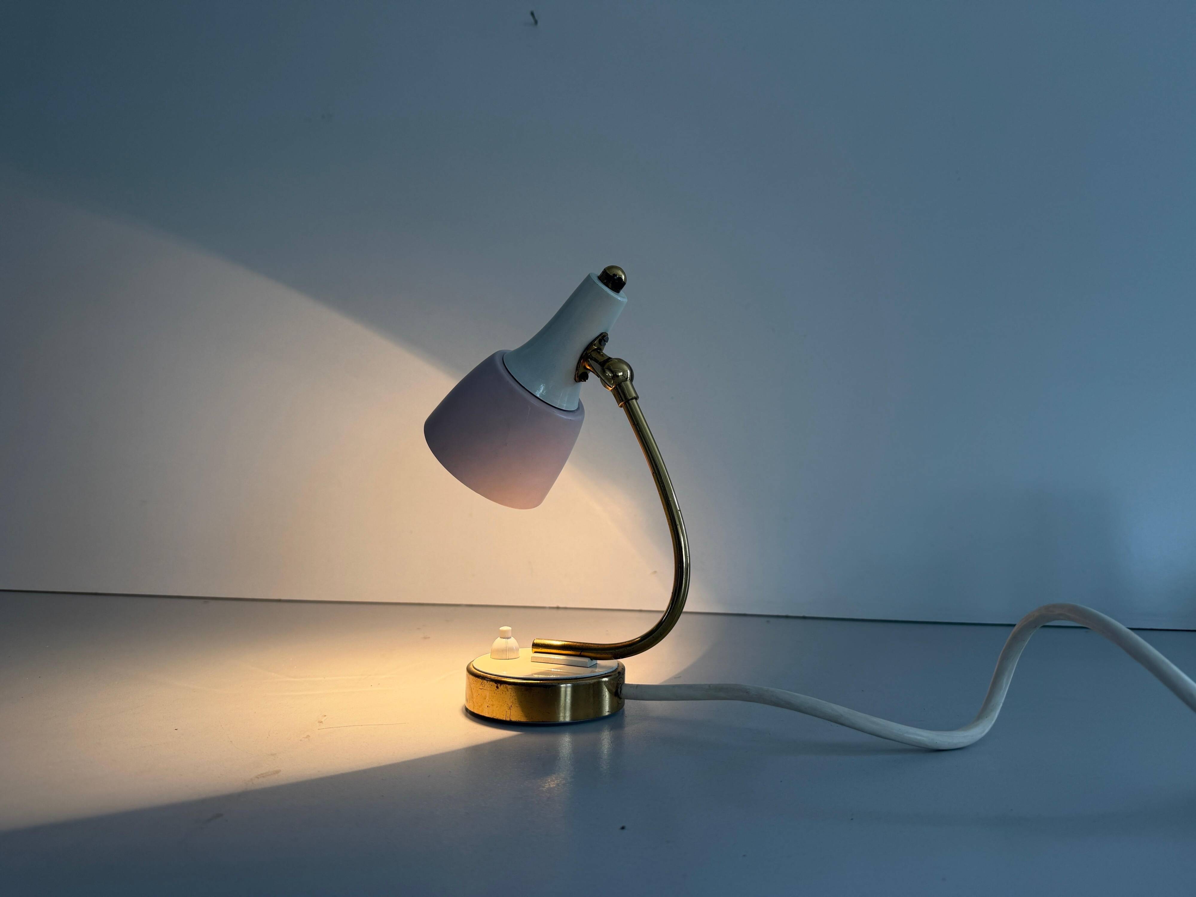 Simple table lamp with a pink metal head and brass body, 1960s, Germany.