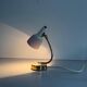 Simple table lamp with a pink metal head and brass body, 1960s, Germany.