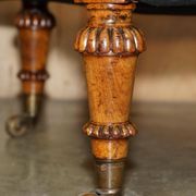 High Victorian leather tête-à-tête canapé with a walnut burr chessboard.