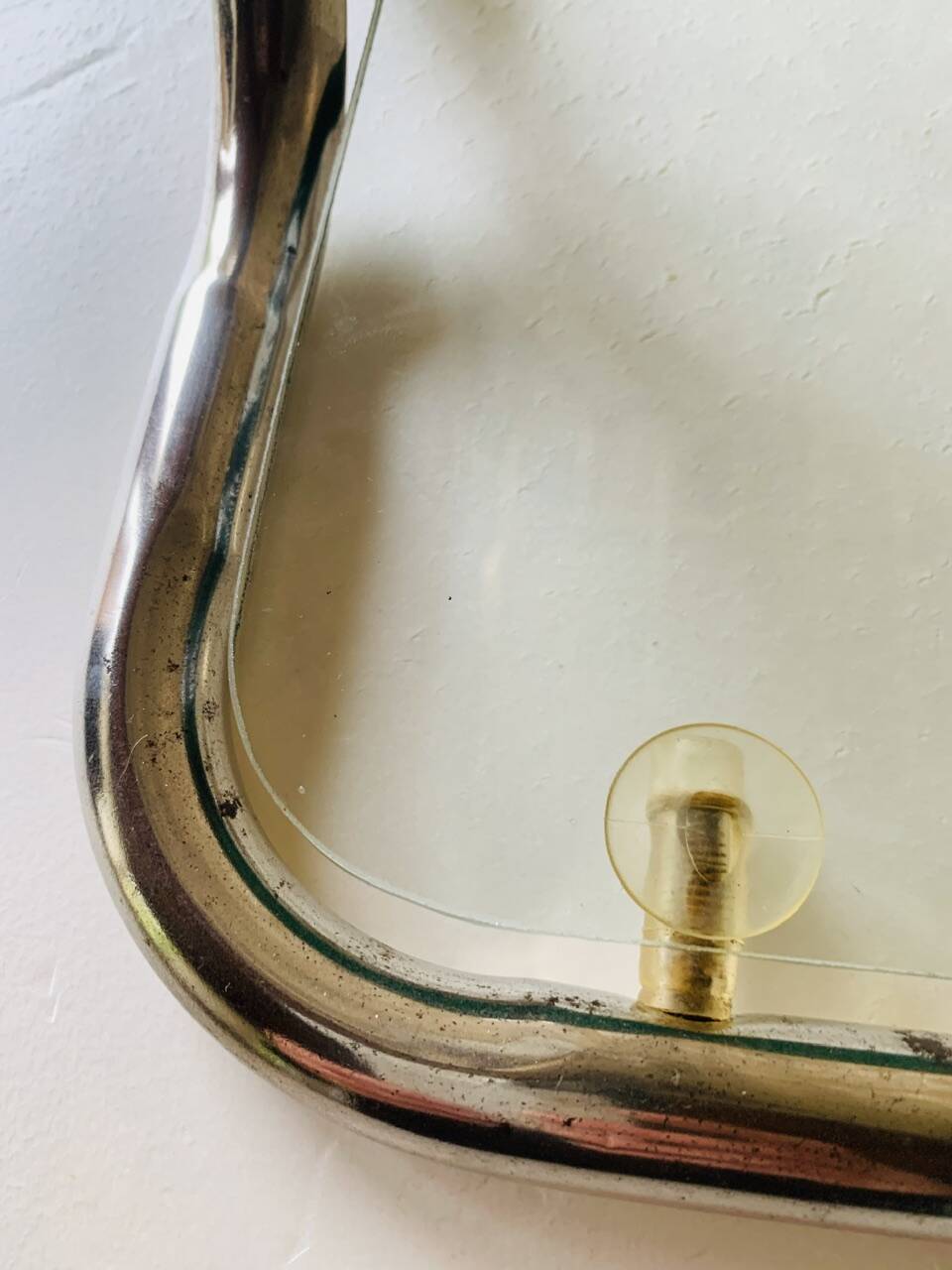 Glass and brass side table with magazine rack, circa 1970's