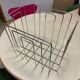 TMP magazine rack by Willy Glaeser, stamped