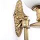 Three brass and opaque glass wall lights, 1950s.