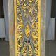 Rectangular Indonesian construction element with blue and yellow plant in carved wood