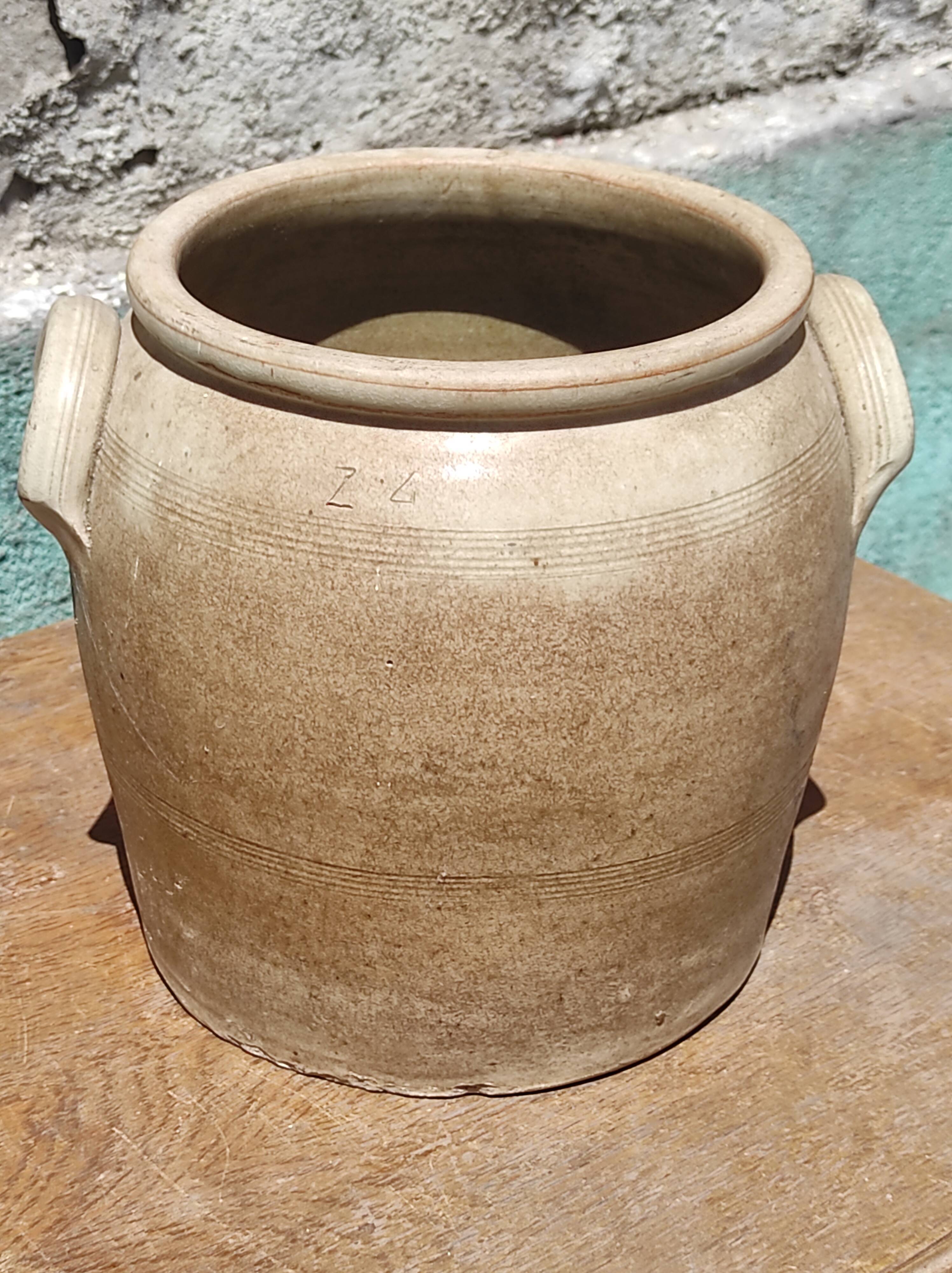 Old grease pot or confit in glazed rustic sandstone vase storage pencils brushes kitchen