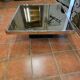 Chrome coffee table with smoked mirror top