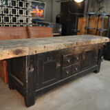 Former 1930 carpenter's workbench has black patinated doors and drawers