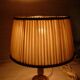 Empire style lamp in golden brass with pleated shade