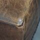 Beautiful sheepskin ottoman on high legs and beautiful warm colours