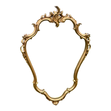 Louis XV Style wood and gilded stucco mirror with animated shape