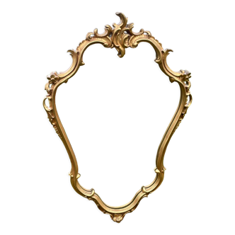 Louis XV Style wood and gilded stucco mirror with animated shape
