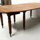 Louis Philippe six-legged table in solid cherry wood, 19th century