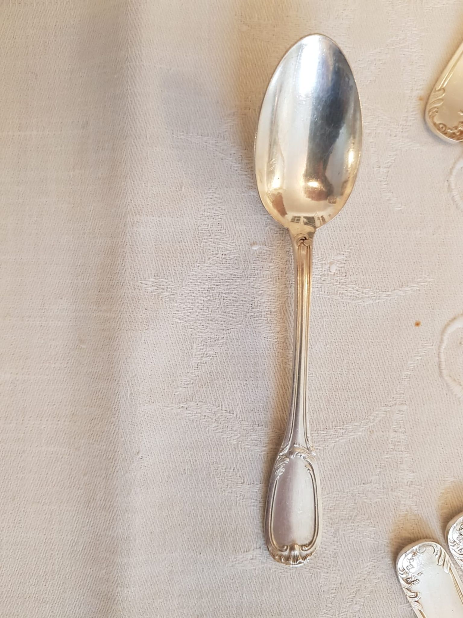Silver cutlery set for 36 place settings and its ladle.