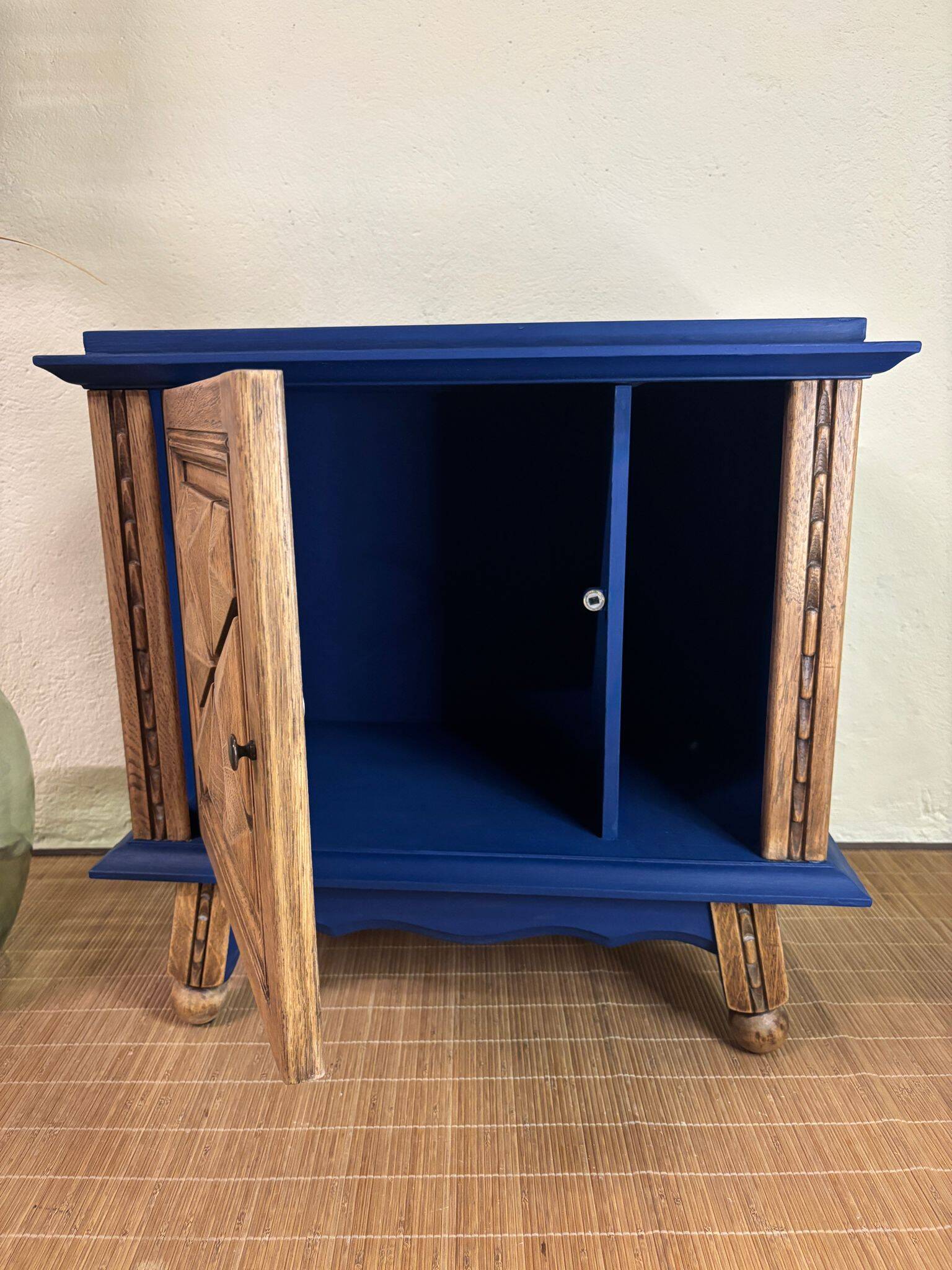 Small vintage upcycled side table in midnight blue and raw wood, with a rose-shaped door.