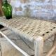poplar bench and braided doum (palm tree)