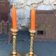 Set of two candlesticks in brass dore, pattern of ivy leaves chiseles on the columns, vintage