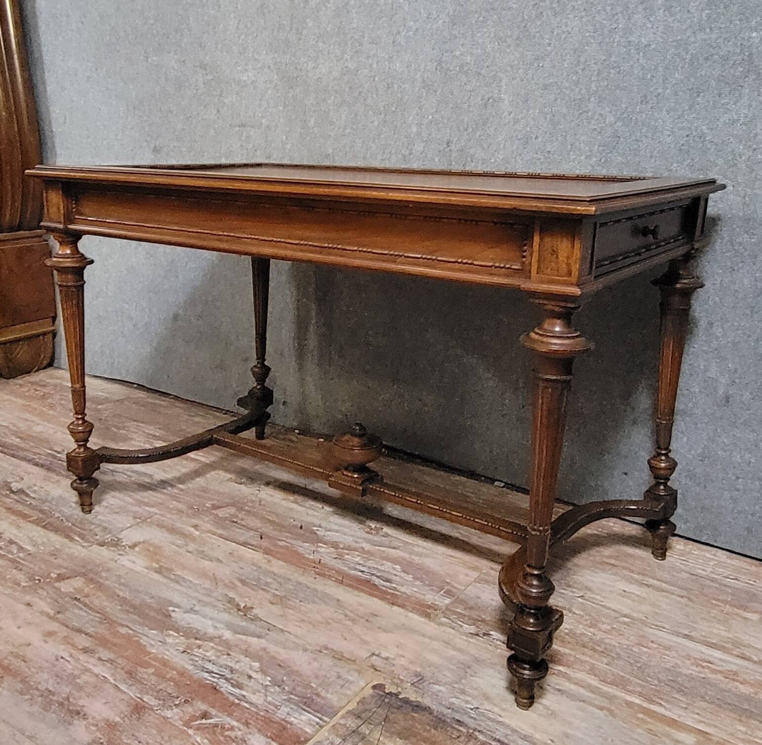 Louis XVI style desk with a curved top, in mahogany.
