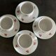 4 coffee cups with cherry motifs
