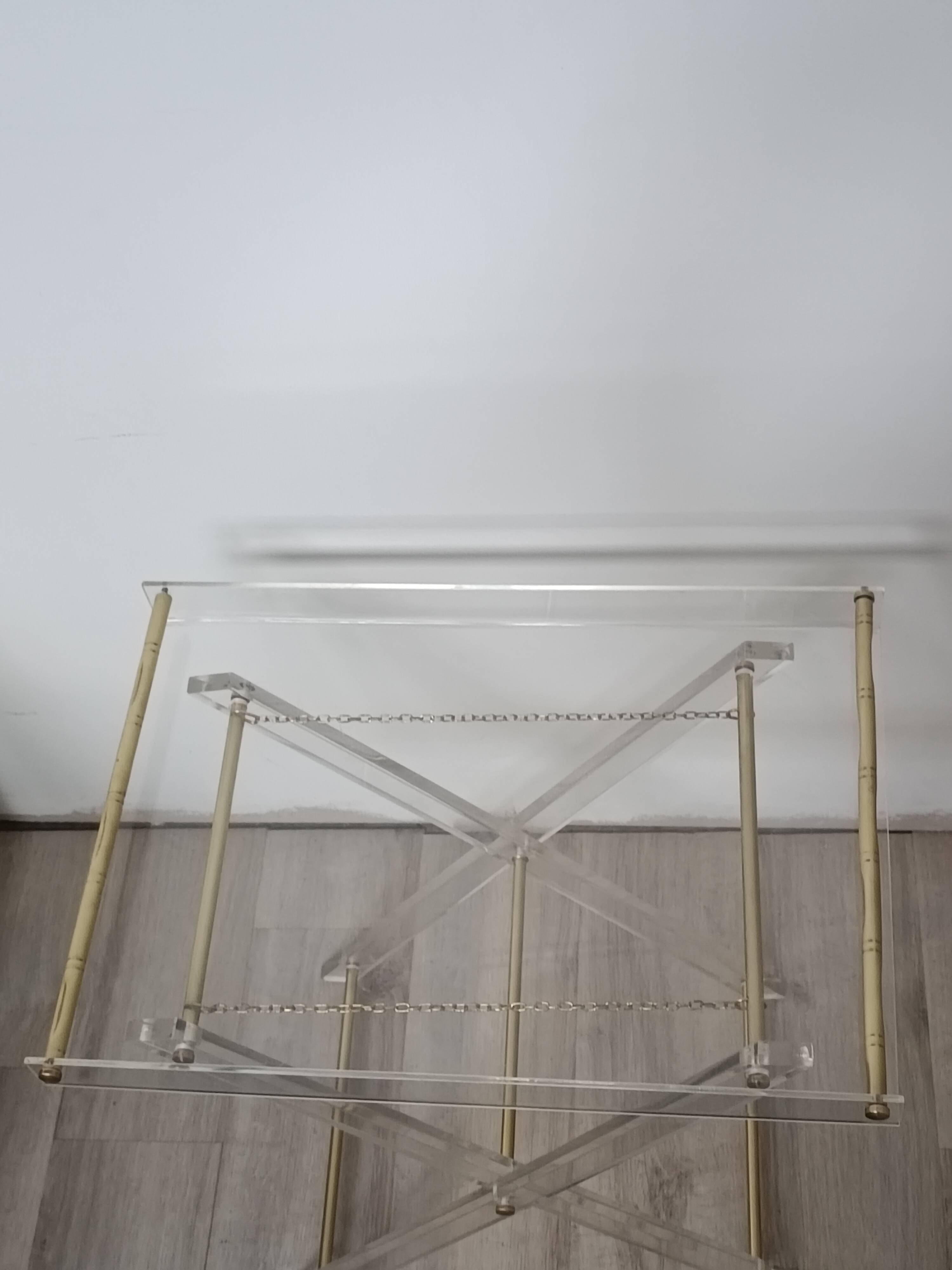 Folding side table in plexiglass and brass, 1970s.