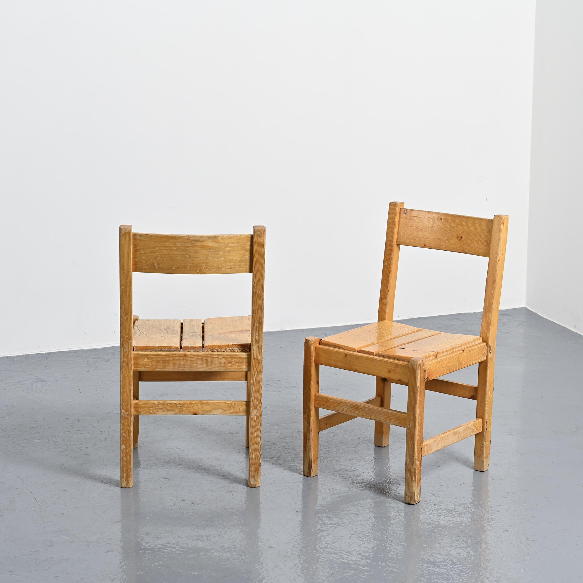 Pair of pine chairs, Maison Regain, France, circa 1970.