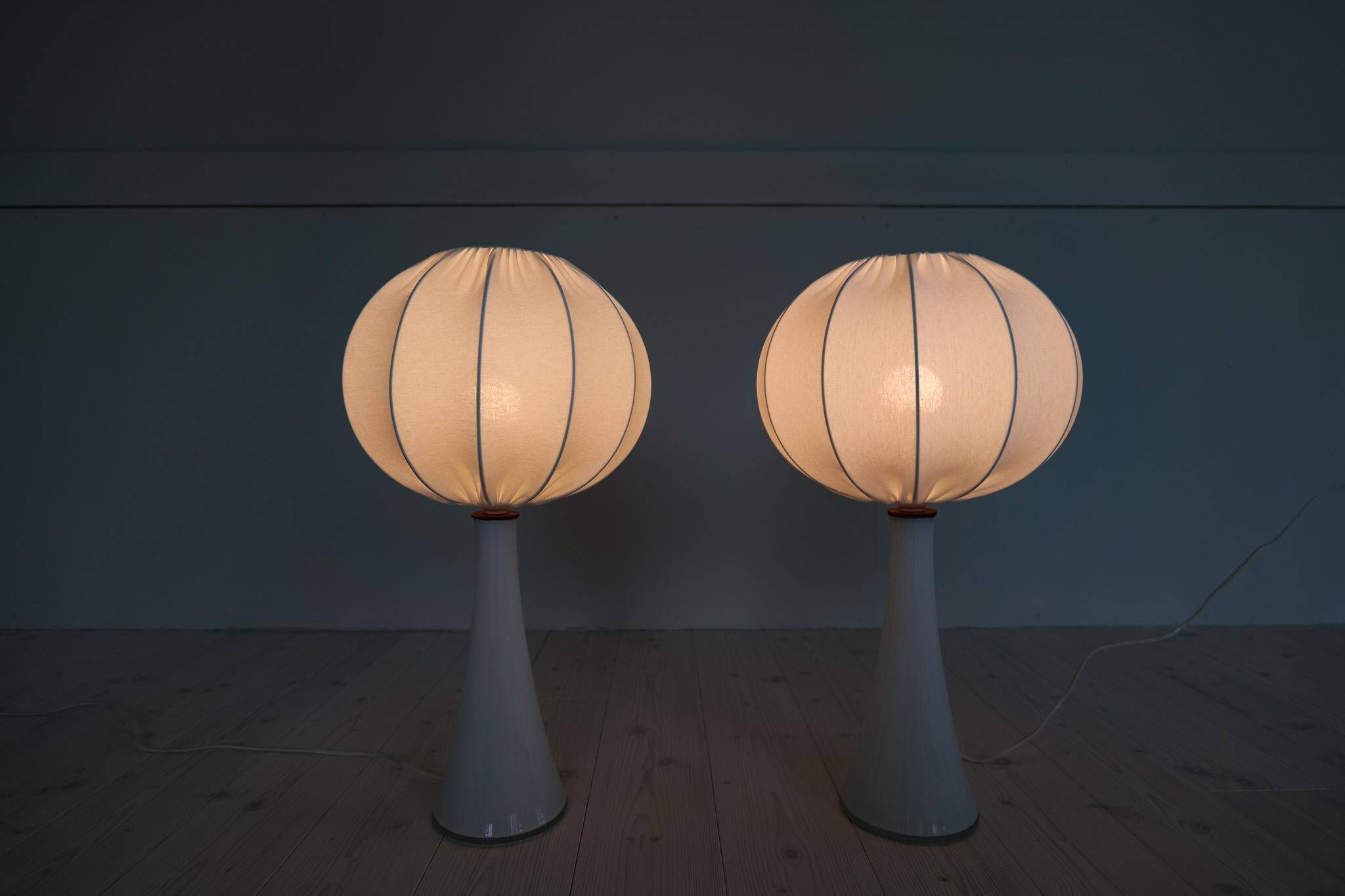 Pair of mid-century opaline glass table lamps with cotton shades by Bergboms, Sweden, 1960.