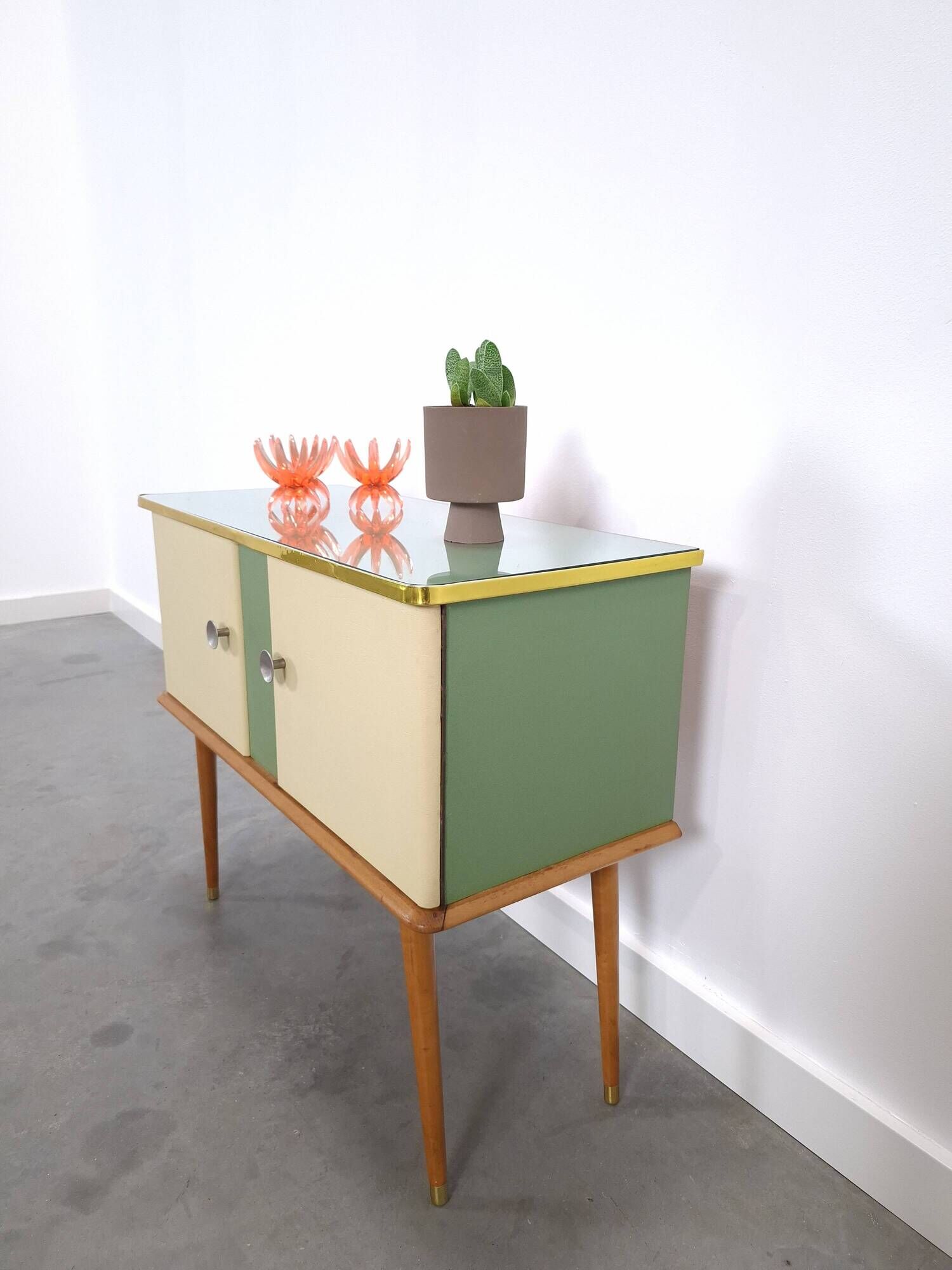 Vintage green DDR cabinet, model Libelle with glass top, slanted legs.