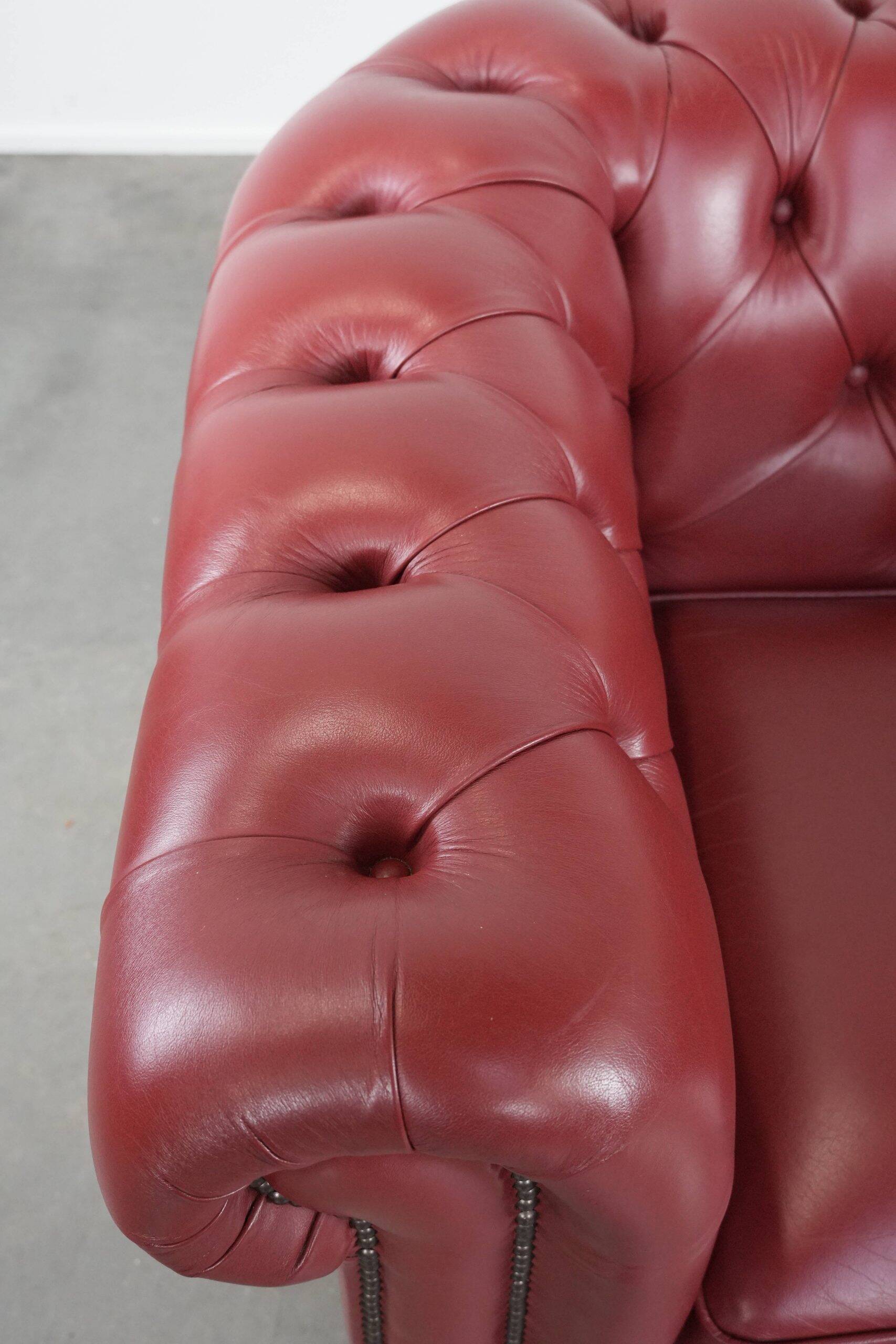 Amazing English cowhide Chesterfield armchair in a stunning red colour