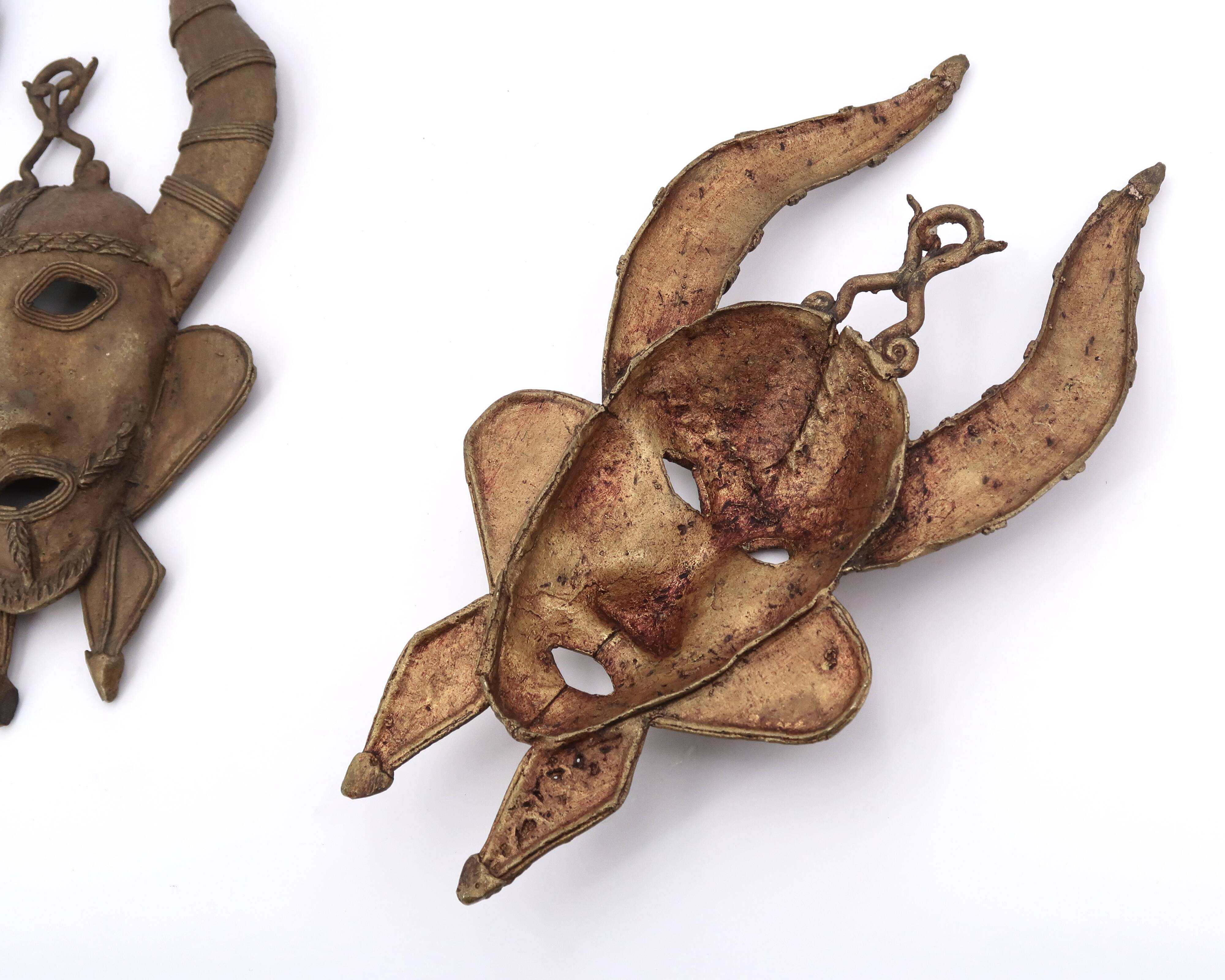 Pair of African brass masks, 1970s