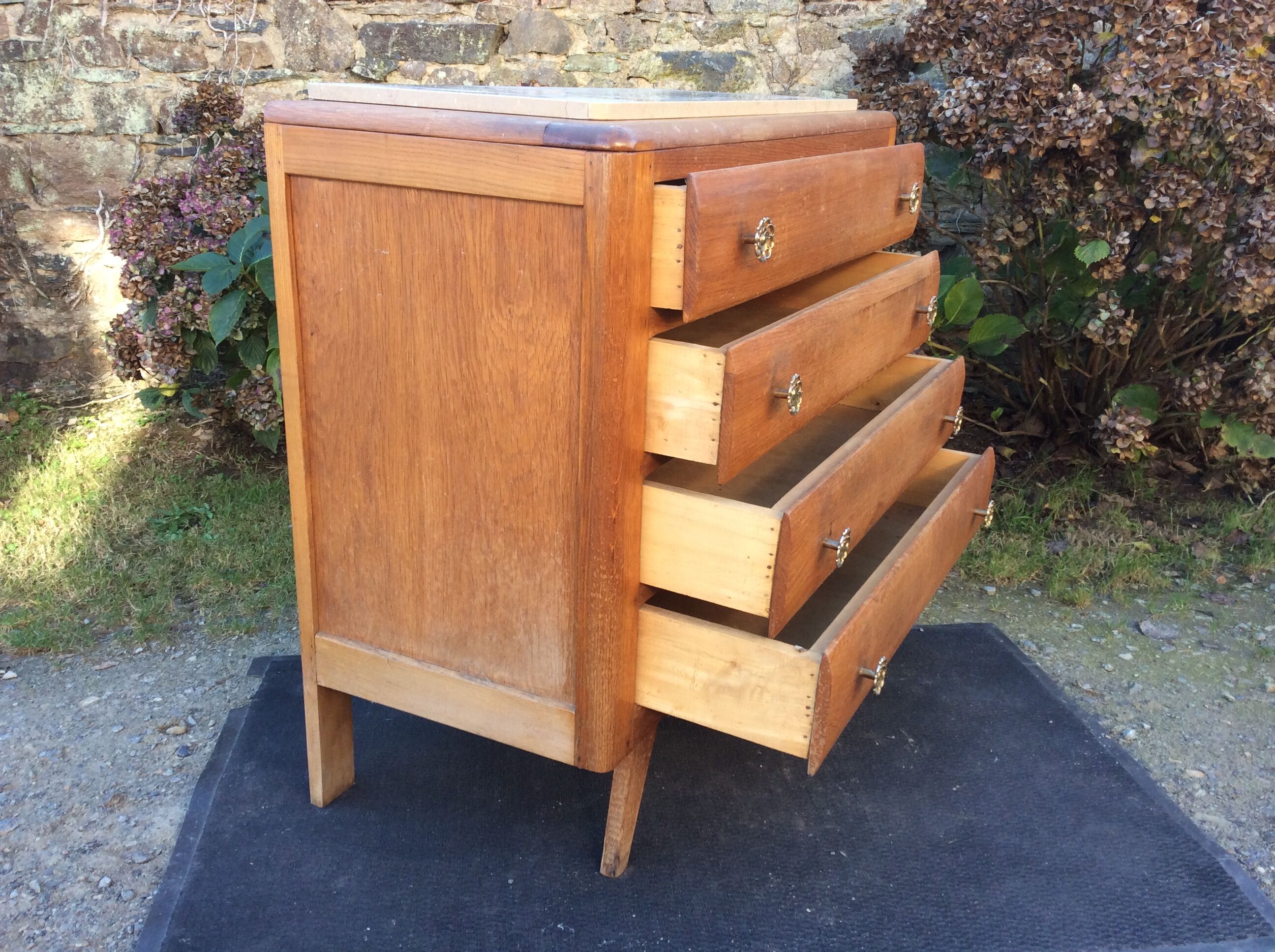 Vintage chest of drawers with oak compass base with marble top.