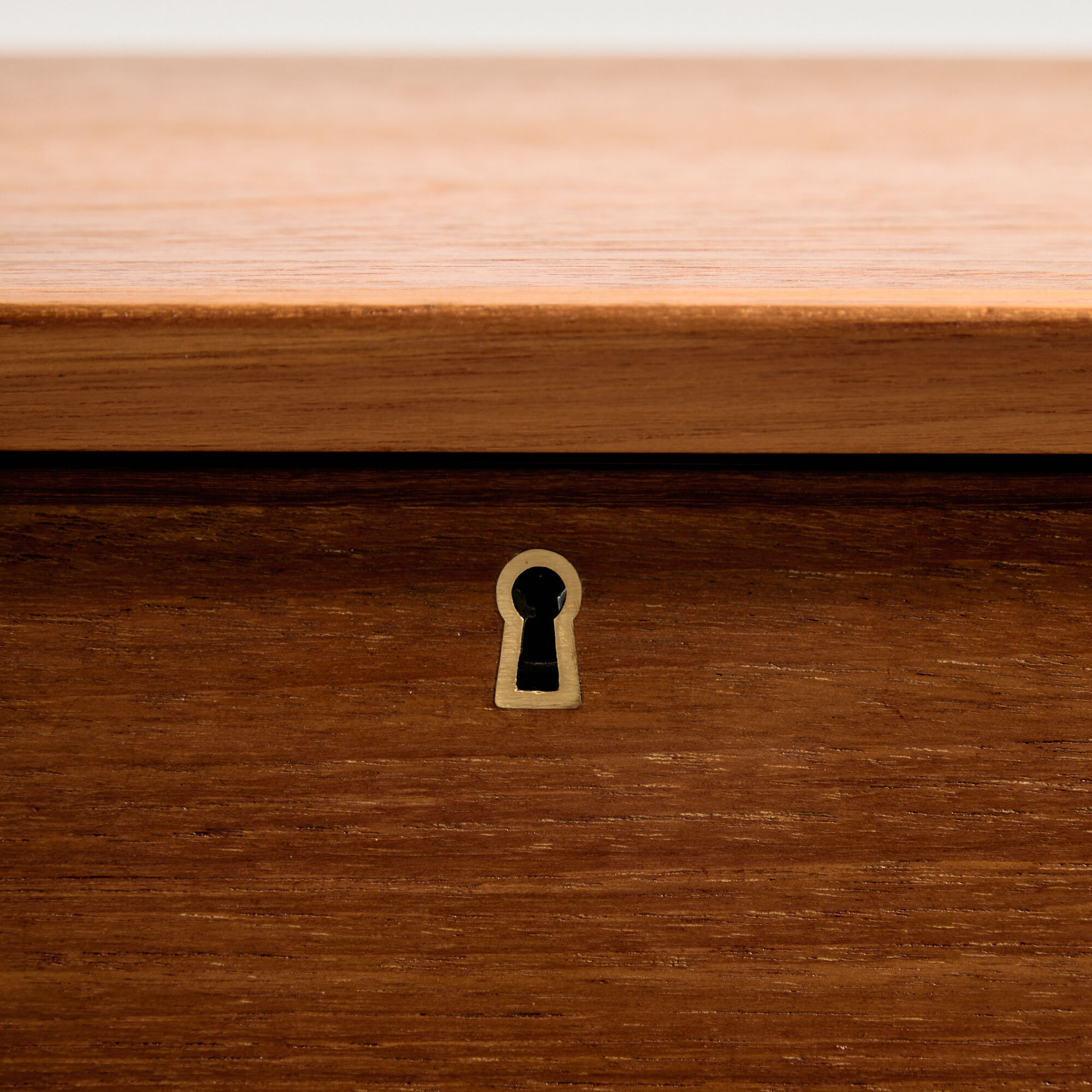 Restored teak chest of drawers with seven drawers.