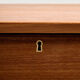 Restored teak chest of drawers with seven drawers.