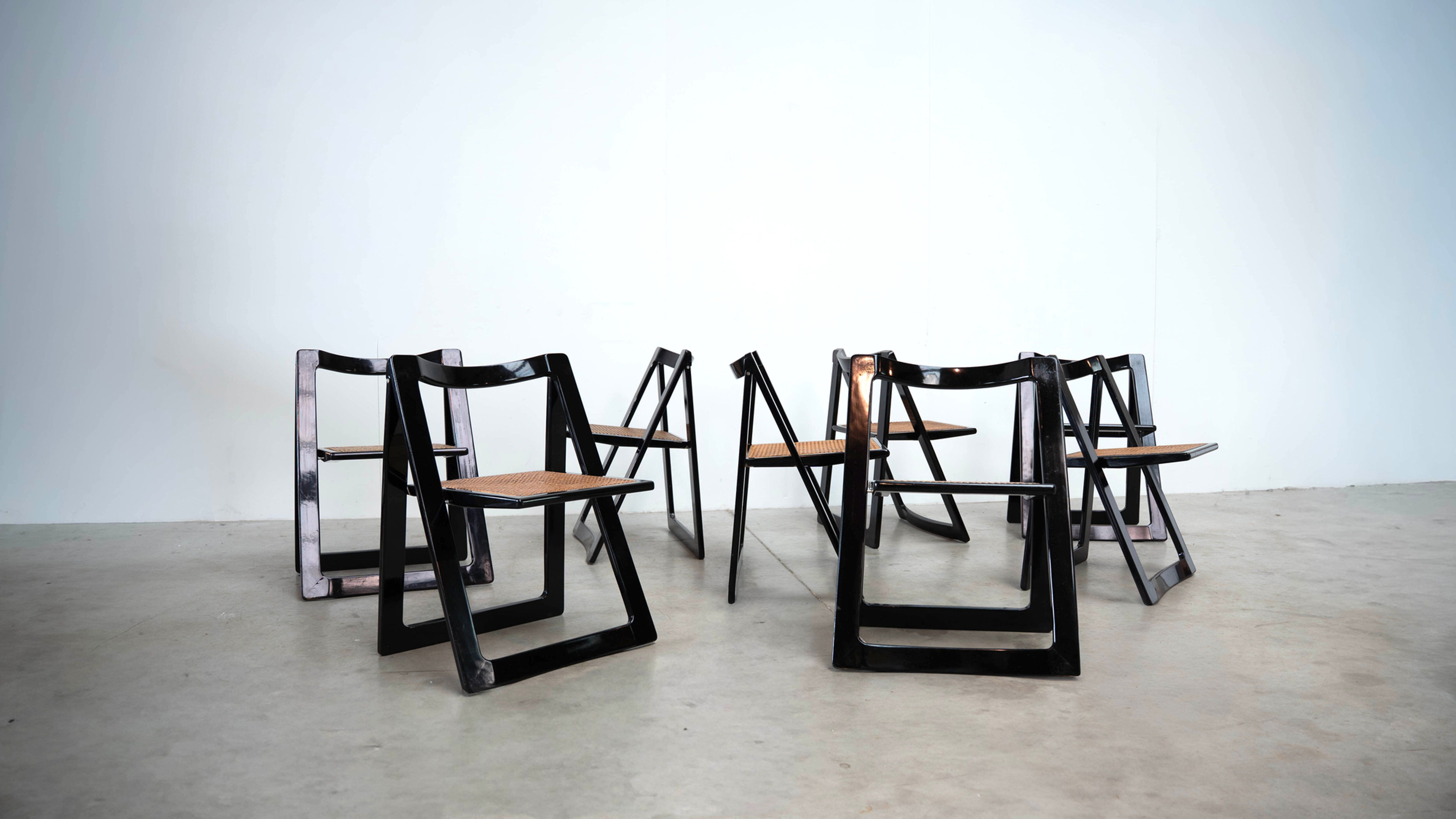Set of eight folding dining chairs designed by Aldo Jacober for Alberto Bazzani