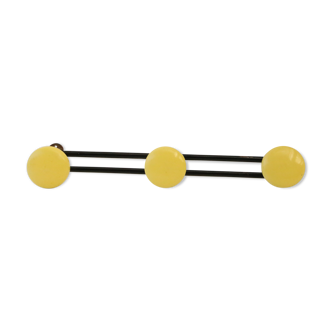 Metal, yellow and black wall coatrack