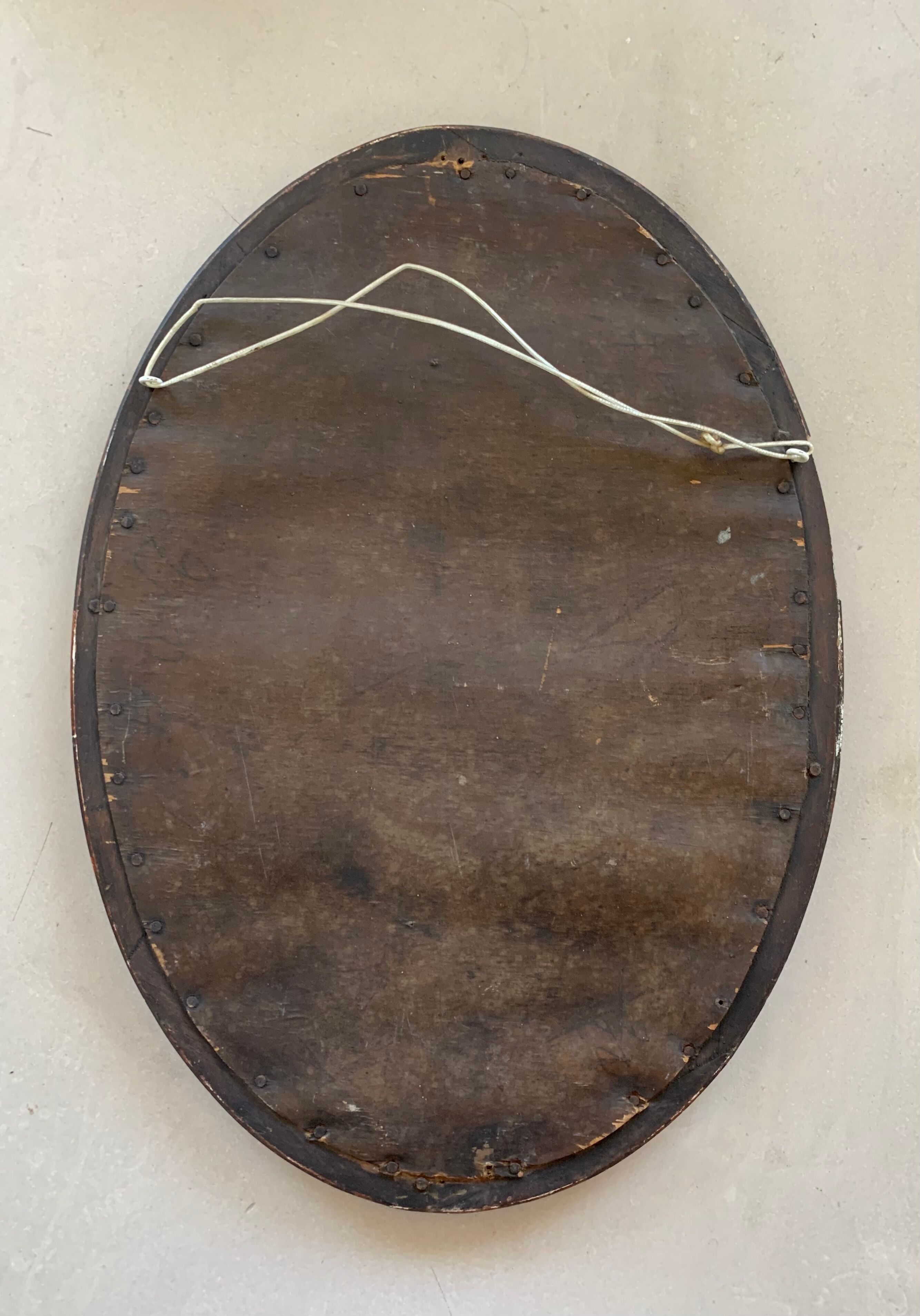 Old stitched oval mirror, 53x37 cm