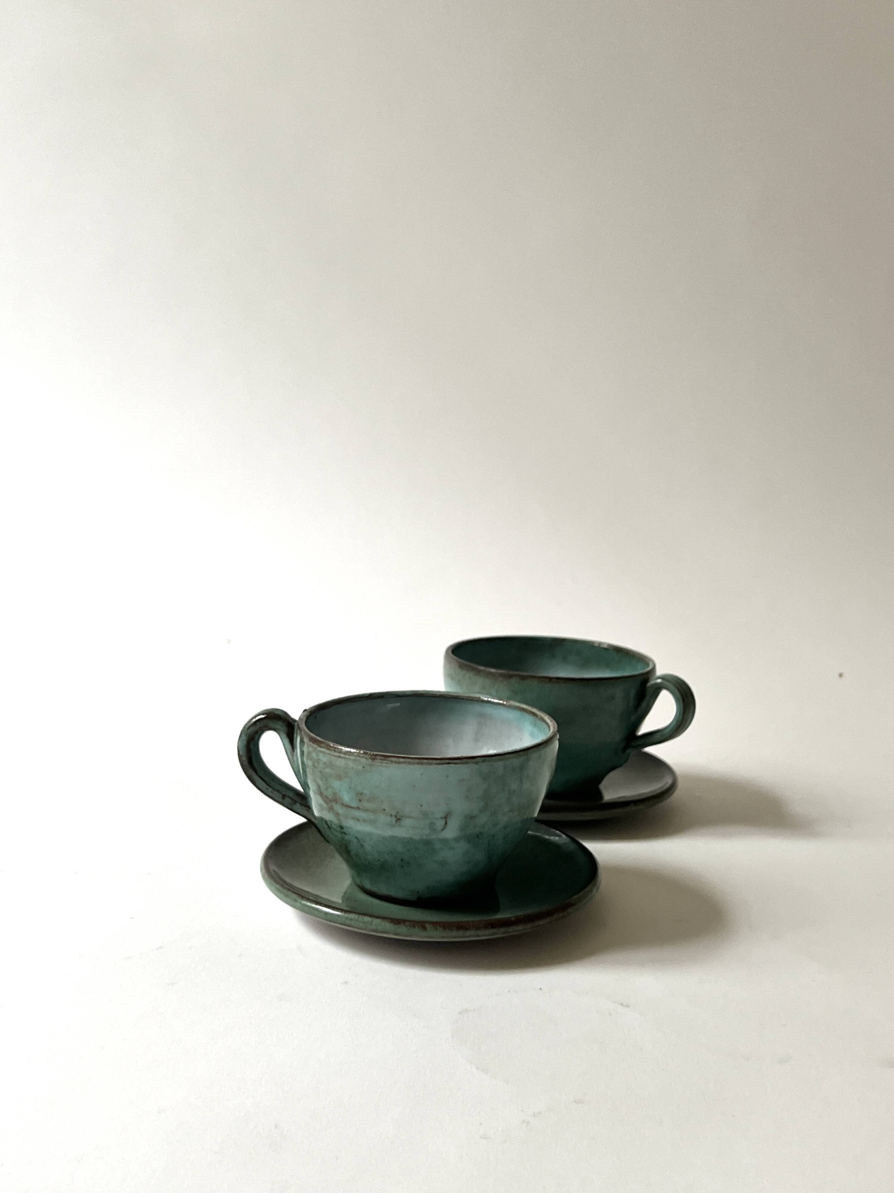 Handmade and signed glazed ceramic coffee cups, circa 1950.