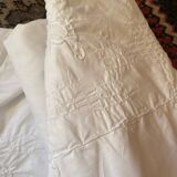 White tablecloth in fine embroidered white cotton.