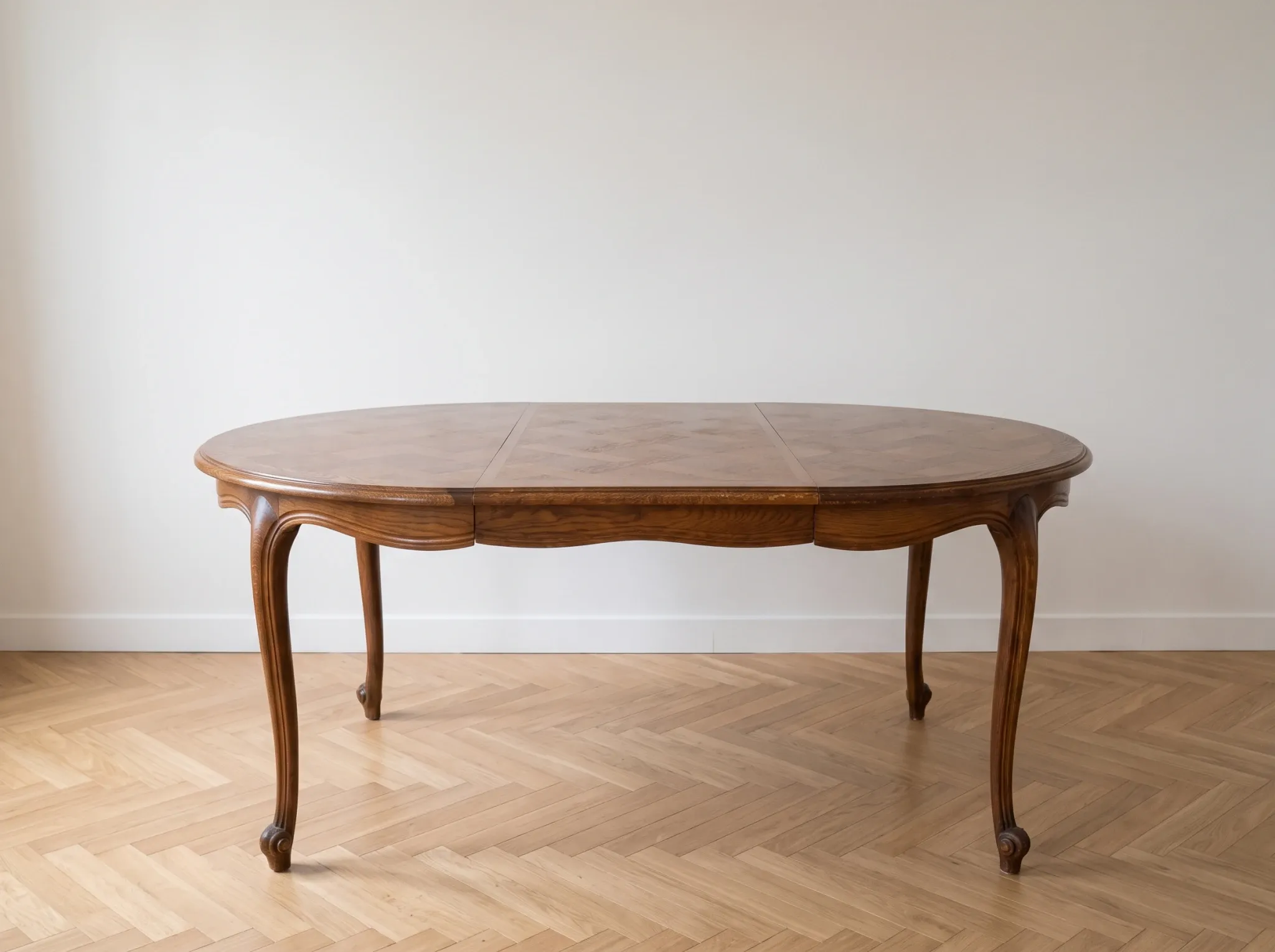 Round extendable dining table in Louis XV style made of wood.