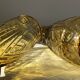 Duo of art deco vases in yellow glass with scroll patterns