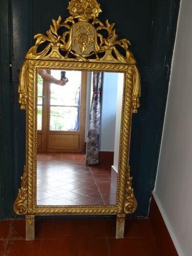 Miroir en bois sculpté doré époque xixème h142 cm