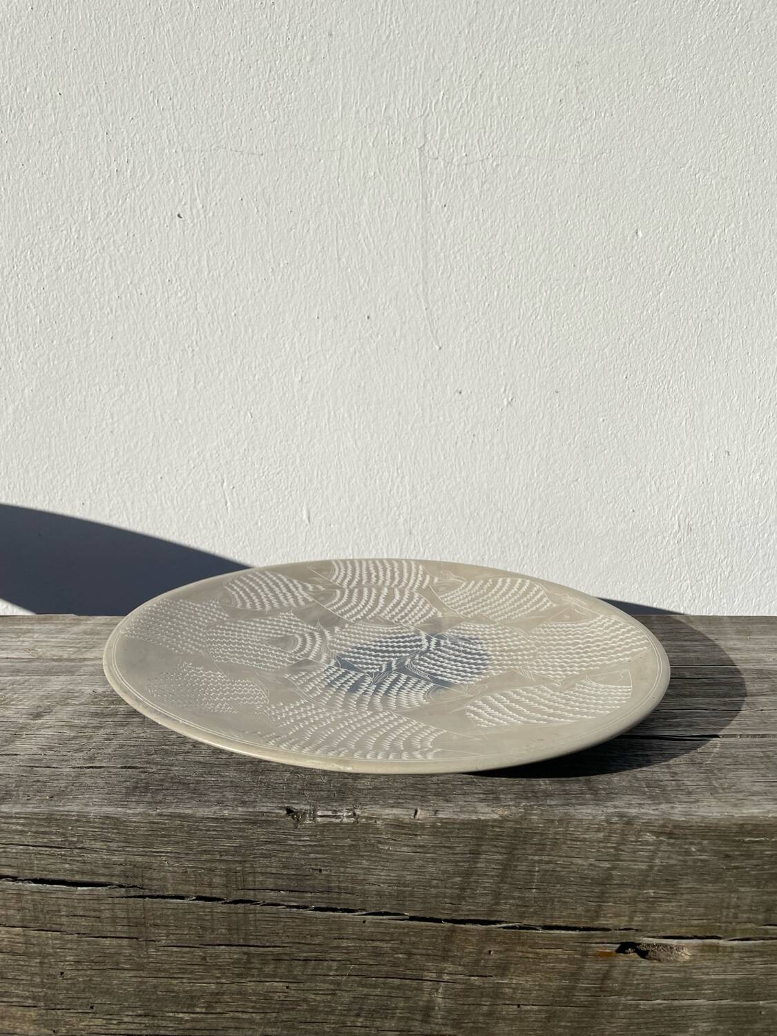 Ethnic handmade round fish dish