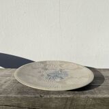 Round ethnic handmade fish dish