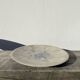 Ethnic handmade round fish dish